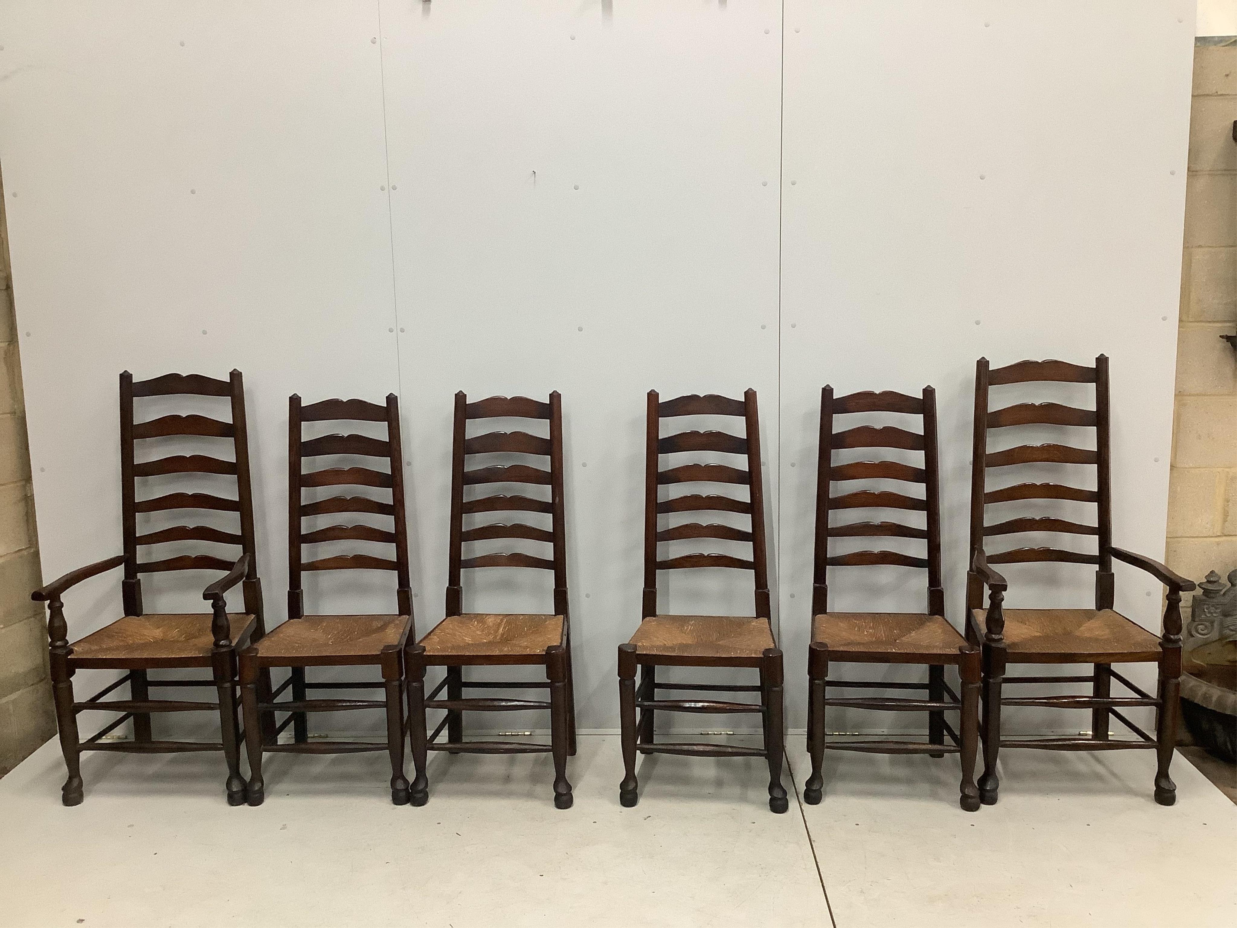 A set of six 18th century style oak ladder back dining chairs with rush seats, height of carvers 124cm, width of carvers 54cm and a 17th century style oak refectory table, width 183cm wide, depth, height 73cm. Condition